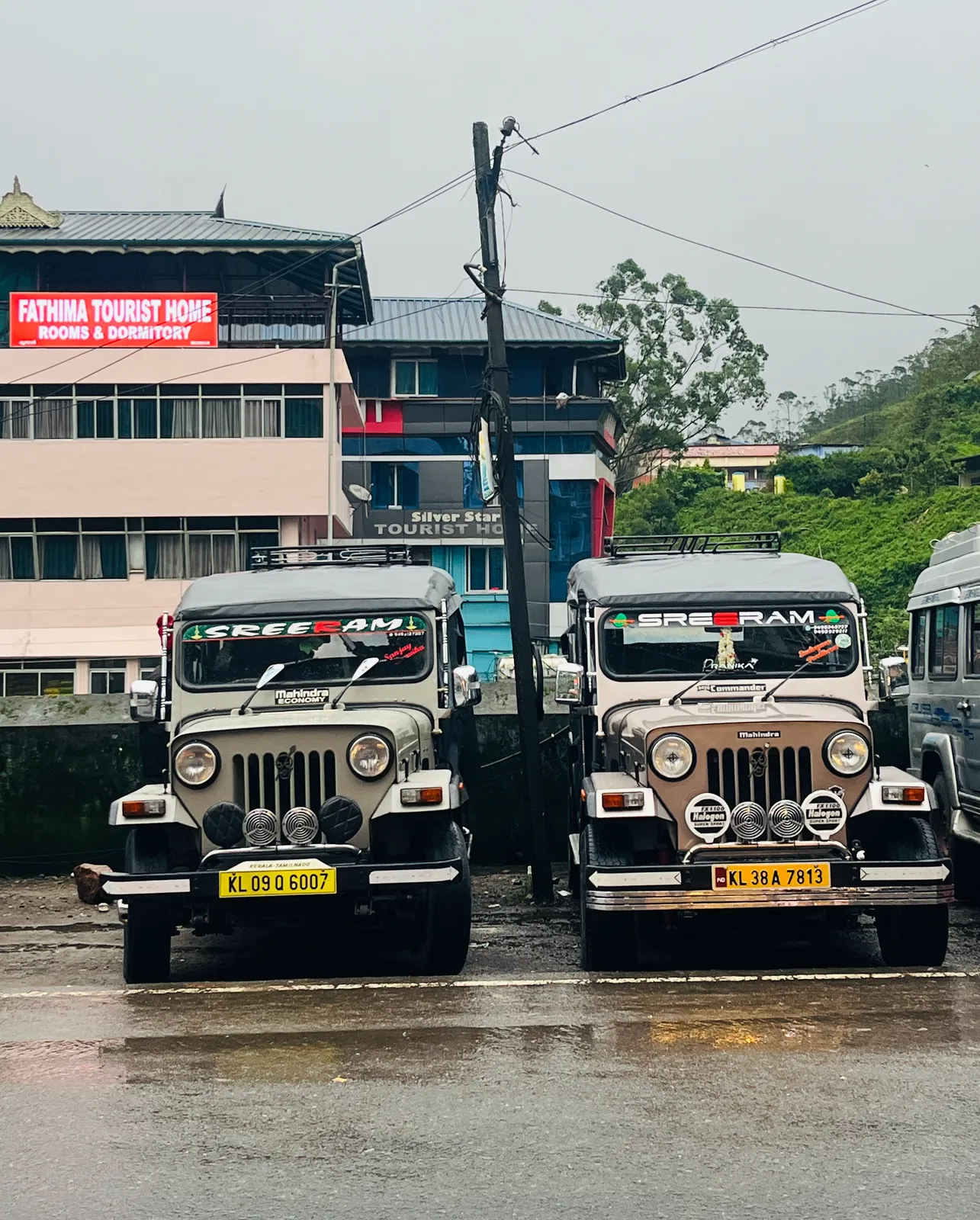 Two Sreeram safari jeeps parked in Munnar town before a morning trip